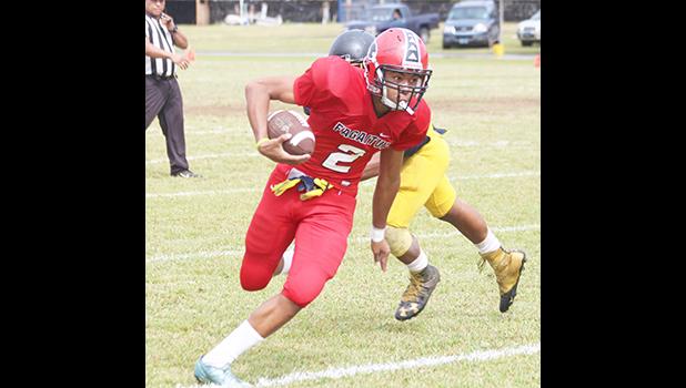receiving a pass from Kitiona for a two-point conversion, in the second half of their Varsity game against Nu’uuli. The Vikings claimed their second victory of the season with 53 unanswered points this past Saturday.  [photo: TG]