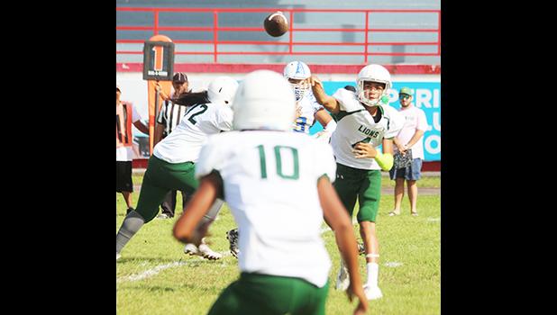 Leone's Oakland Salave’a quickly turning to his receiver for a pass on a receiver screen play during the opening quarter of their JV game last Saturday morning against the Sharks. The Lions lost 6- 34. [photo: TG]