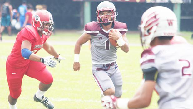 Koison Ozu (1) for the Warriors returning this punt during the second half of a Junior Varsity game against the Faga’itua Vikings last Saturday morning at the Veterans Memorial Stadium. Ozu led the Warriors to a 24-0 victory. [photo: TG]