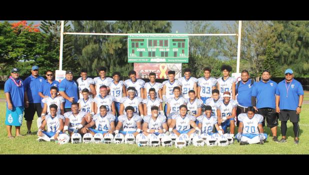 It's the Blue Empire’s pride & joy: the Samoana Sharks Junior Varsity Team has been named the 2017-18 ASHSAA JV Football Champs, securing a ‘Back-2-Back’ run last Thursday evening in their final game of the season against the Vikings. Leading the Sharks this year were principal Tupa’i Rod Atafua (far left) and head coach Pati Pati (far right). [photo: Donald Joe Brandt]