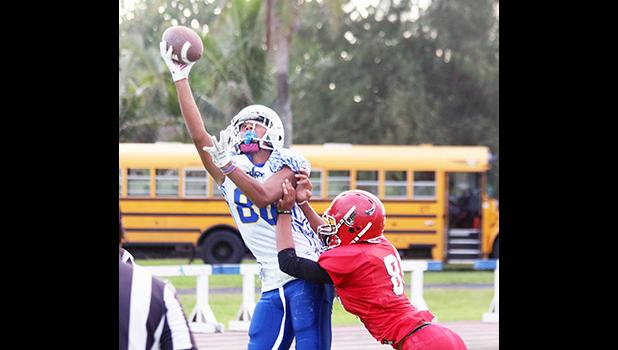 Avery Seumanutafa of the Sharks going up high for the one handed catch during Samoana's two point attempt in the opening quarter of the game. The attempt was called back by officials based on a ruling that his feet were out of bounds.  [photo: TG]
