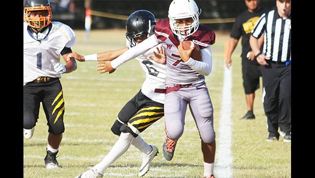 Tafuna Warriors' John Allen getting forced out of bounds during their JV game against the Wildcats last Friday. Allen helped the Warriors to a 42-14 victory. [photo: TG]