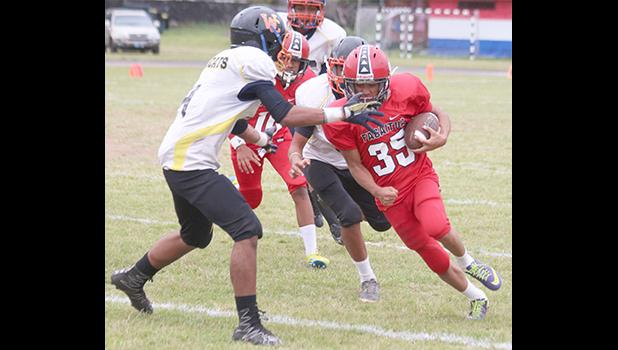 O’Neil Ah Ching of the Vikings storming towards the sidelines to gain huge yardage for Faga'itua in their Junior Varsity match up against the Wildcats last Friday evening – the Vikings won 8-0.  [photo: TG]