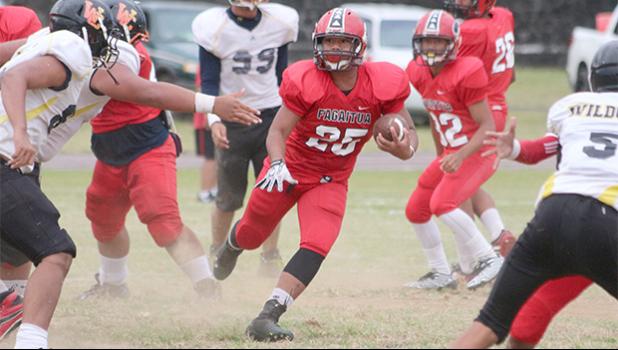 Faga’itua Vikings running back, Jesse Toilolo dancing through midfield and reading his defenders as he carries the rock for the Vikings in the second half of their Junior Varsity game against the Wildcats last Friday evening. Toilolo helped the Vikings to a 8-0 victory.  [photo: TG]