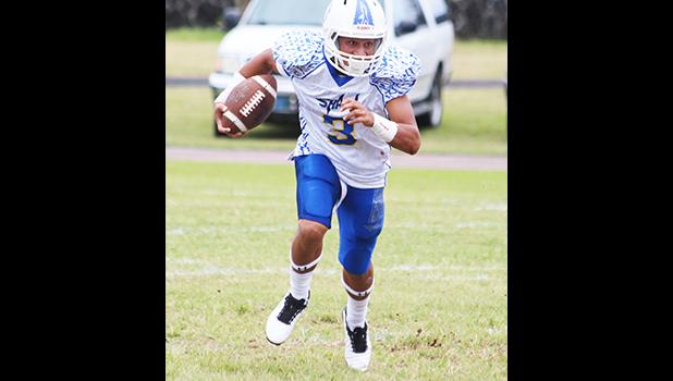 Paul Fano of Samoana racing towards the corner of the goal line to take this two point conversion in for the Sharks – his third successful extra point conversion attempt of the match. Fano led the Sharks in a 46- 8 win against the Warriors in the JV division. [photo: TG]