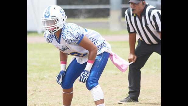 Daniel McMoore, the heart of Samoana’s defensive unit reading a motion by the Vikings offense during the second quarter of their JV game last Saturday morning. McMoore led the Sharks to a near shut out of the Vikings in their 32 - 6 victory.  [photo: TG]