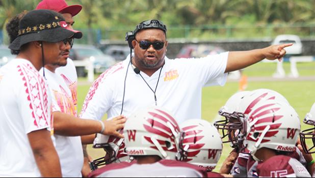 Tafuna Warriors head coach pointing towards the Vikings sidelines and encouraging his Warriors during a time out of a JV game against the Vikings last Saturday morning, where Tafuna smashed Faga’itua in a 24-0 shut out JV victory.  [photo: TG]