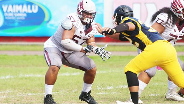 One of Tafuna’s key players, AJ Talafu, a Junior Offensive Lineman from Nu’uuli dropping on a pass block against Dennis Enoka of NVTHS during a varsity match up last Saturday morning. Talafu helped the Warriors to a 38-12 victory against the Wildcats.  [photo: TG]