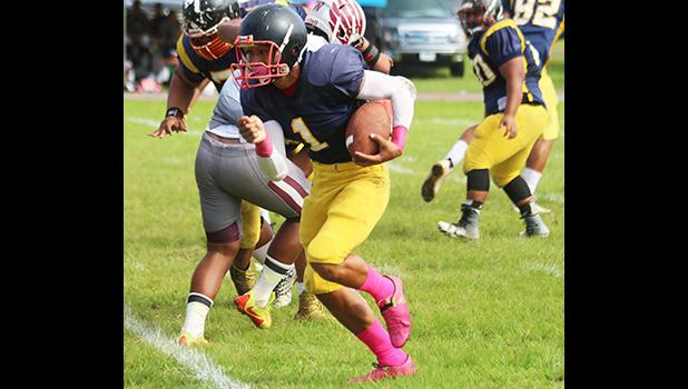 Iosefa Mauga turning on his boosters and taking this one to the end zone for his second touchdown of the game against the Warriors. Mauga score both of Nu’uuli’s touchdowns, but they lost to Tafuna 12-38.  [photo: TG]