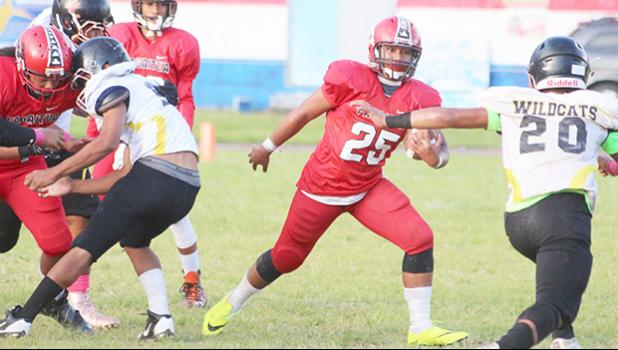 Jesse Toilolo of the Vikings trying to work his way through the Wildcats defense, during the opening quarter of their JV match where the Vikings lost to the Wildcats 6-14.  [photo: TG]