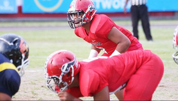 Freshman middle linebacker Georgia Mageo of the Vikings varsity squad, reading Nu’uuli’s offensive unit just before the snap in the opening half of their matchup last Friday evening. Georgia and his twin brother Georgie are two of the three freshmen who are starters for the Vikings varsity squad.  [photo: TG]