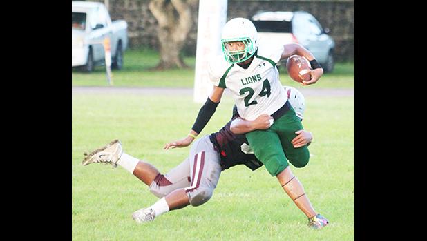 Joshua Taani of Leone returning an interception in the second quarter of their junior varsity match up against the Warriors last Thursday evening. Taani helped the Lions ito a 16-6 victory over Tafuna.  [photo: TG]