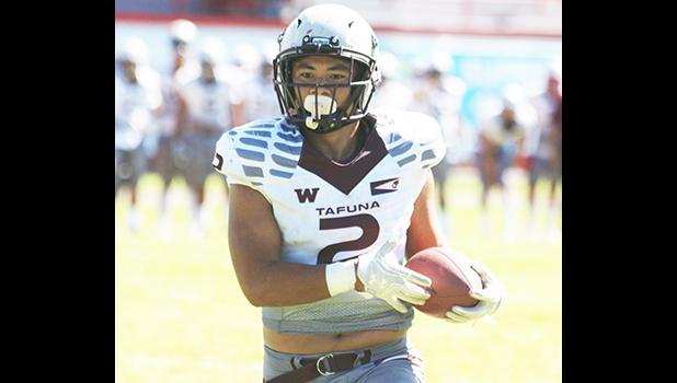 Tafuna Warriors Koison Ozu with the ball