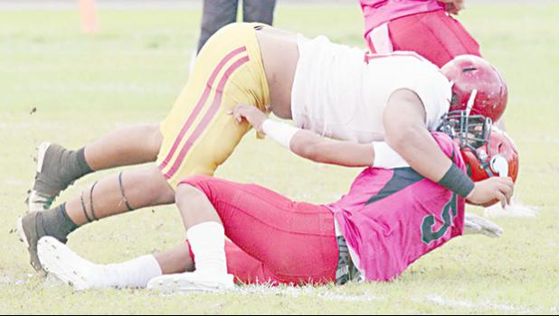 Faga’itua Vikings Ina Ta’ase is stopped immediately in the back by big Francis Mauigoa