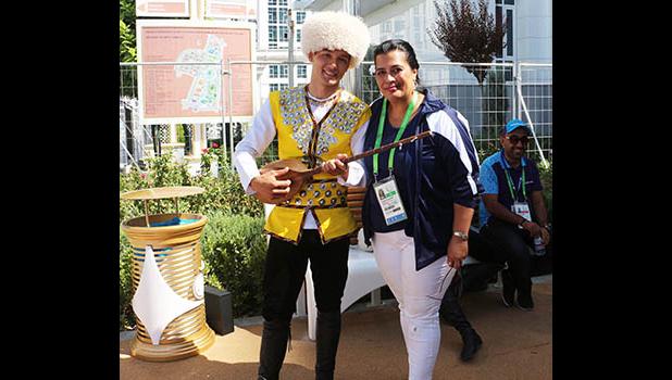 Terry Custodio Auva’a, Team American Samoa’s Press Attache for the 2017 - 5th Asian Indoor and Martial Arts Games, takes time out for a photograph with a Turkmenistan dancer and dutar player during the First Official Team Welcoming Ceremony . (Photo:ASNOC\TCA) Terry Custodio Auva’a, Team American Samoa’s Press Attache for the 2017 - 5th Asian Indoor and Martial Arts Games, takes time out for a photograph with a Turkmenistan dancer and dutar player during the First Official Team Welcoming Ceremony . (Photo:ASNOC\TCA)