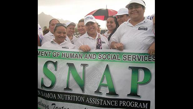 SNAP staff with sign