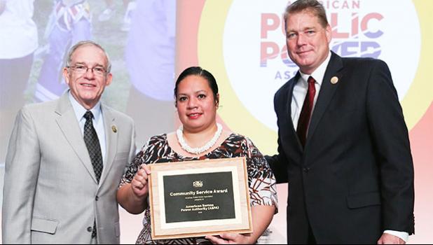 Edna Noga (middle) accepting for ASPA, the American Public Power Association Community Service Award