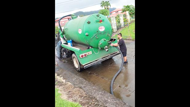 Crew from the American Samoa Power Authority with their vaccumn truck
