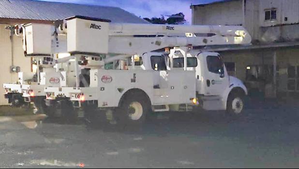 Two newly acquired bucket-trucks at the ASPA compound