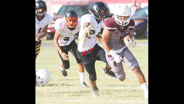 Tafuna’s ‘Samurai’ Koison Ozu, returning this kick off all the way to the end zone to score his first touchdown of the game – a 91 yard touchdown return in the first half of a JV game against the Wildcats last Friday evening.  [photo: TG]
