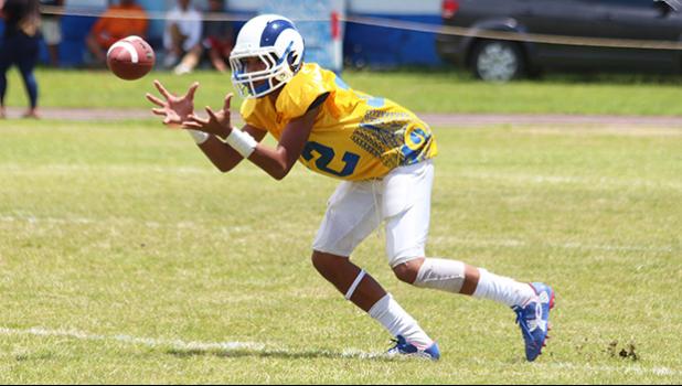 The AYFS Rams defensive back, Fano – about to pick off his first interception of the game against the AYFS Packers - during the season opener last Saturday at the Veterans Memorial Stadium. [photo: TG]