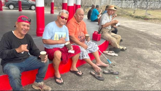 Elders of Auto Ward assist with the landscaping at Fagaitua High School