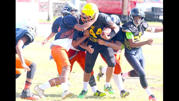 Joseph Nanai is met immediately in the backfield for a sack by a host of Bears defenders during the opening half of their semi-final match up last Saturday. The Bears won 20-6. [photo: TG]