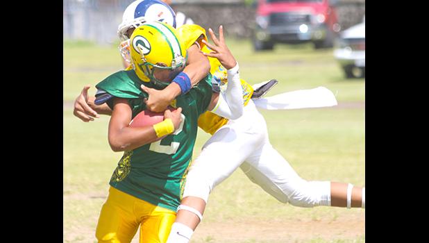 Alfred Maiava is tackled hard by Johnny Fano of the Rams behind the line of scrimmage for a sack during the opening half of their semi-final match up last Saturday. Fano helped the Rams to a 22-14 win to secure them a spot in the championship game against the Bears this Saturday. [photo: TG]
