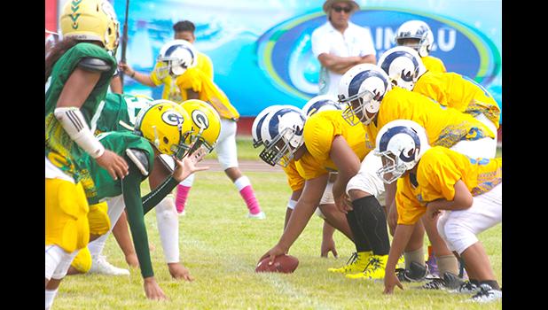 The Rams offensive unit readying to snap the ball against the Packers defense during the second half of their semi-final match last Saturday. The Ram defeated the Packers 22-14. [photo: TG]