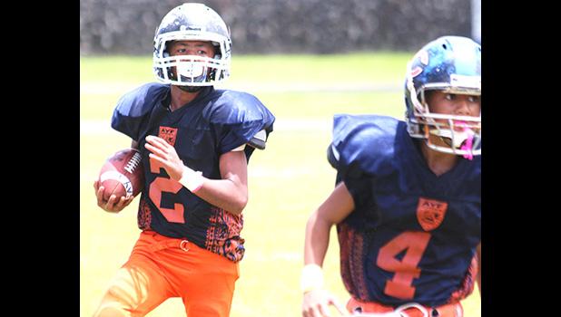 Offensive Player of the Game – Marcus Samia of the Bears returning this interception all the way to the end zone for a 55 yard defensive touchdown, the Bears' first touchdown of the game during their championship bout against the Rams last Saturday. Samia helped the Bears to their third AYFS title with a 30-18 win.  [photo: TG]