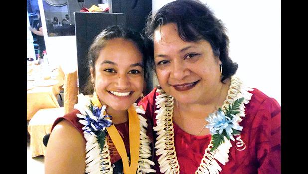 ASCC Admissions Officer Elizabeth S. Leuma congratulates spring 2019 graduate Zemirah Pati.