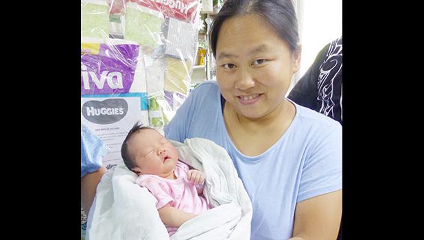 Mrs. Mrs Zhang Chao Jun and her New Year baby