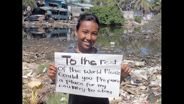 Tuvalu child with sign