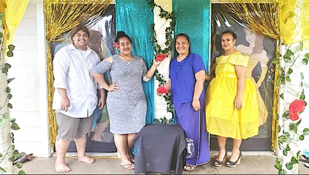Team #3, standing proudly in front of their Beauty and the Beast door. At far right is a staff member dressed as Belle, the main character in the Disney blockbuster.