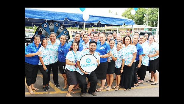 Bluesky Communications employees pose for a group photo, just before the dedication ceremony to open their newly renovated store at the Laufou Shopping Center, yesterday morning.  [photo: TG]