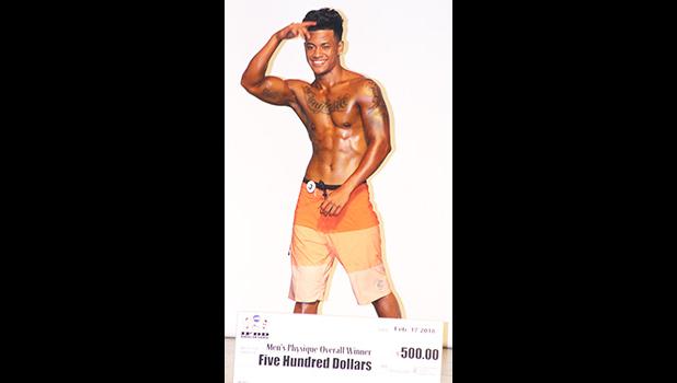 Overall Men’s Physique Winner, Joseph Asiata saluting the crowd. [photo: TG Overall Men’s Physique Winner, Joseph Asiata saluting the crowd. [photo: TG