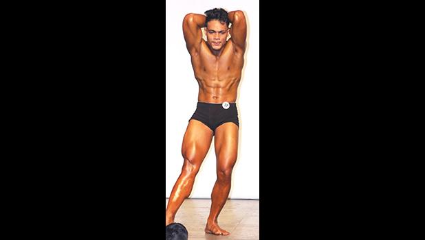 2018 Sau Ia (IFBB) Body Building Overall Men’s Champion, Ben Matale Fili – flexing for the crowd. [photo: TG]