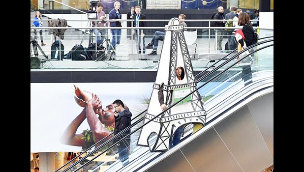  Delegates take moving stairs in the convention center during the COP 23 Fiji UN Climate Change Conference in Bonn, Germany, Friday, Nov. 17, 2017. (AP Photo/Martin Meissner) 