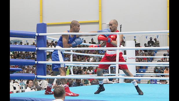  Losifafo Tunoa battling it out with Tongan opponent