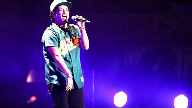 In this Dec. 2, 2016 file photo, Bruno Mars performs at the 2016 Jingle Ball at Staples Center, in Los Angeles. More than 300,000 visitors are expected to descend on Las Vegas for an extravagant New Year's Eve celebration. Nightclubs are pulling out all the stops with performances from DJ Calvin Harris, rappers T-Pain and Kendrick Lamar and artists Drake and Bruno Mars. (Photo by Chris Pizzello/Invision/AP, File) In this Dec. 2, 2016 file photo, Bruno Mars performs at the 2016 Jingle Ball at Staples Center, in Los Angeles. More than 300,000 visitors are expected to descend on Las Vegas for an extravagant New Year's Eve celebration. Nightclubs are pulling out all the stops with performances from DJ Calvin Harris, rappers T-Pain and Kendrick Lamar and artists Drake and Bruno Mars. (Photo by Chris Pizzello/Invision/AP, File)