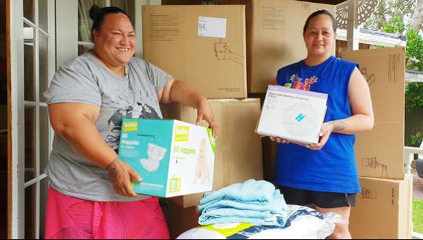 Malia Lameta and Joyce Purcell with boxes of donations
