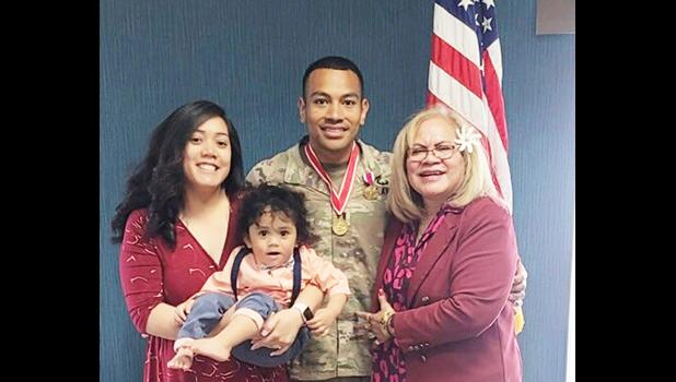 Capt. Paunga with his wife, mother and son