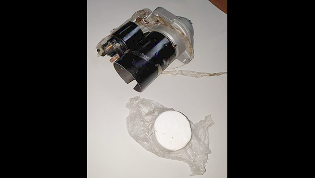 A car part and the baggie of cocaine found in it