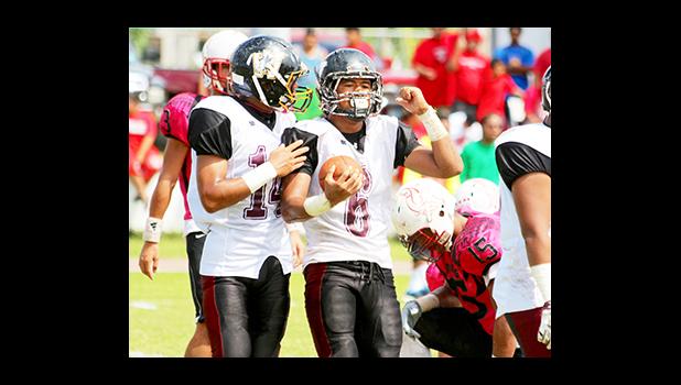 Andrew Toilolo celebrating with teammate Niles Tuamoheloa after Toilolo scored a 2-point conversion in the first half of their championship match against the Vikings last Saturday. [photo: TG]