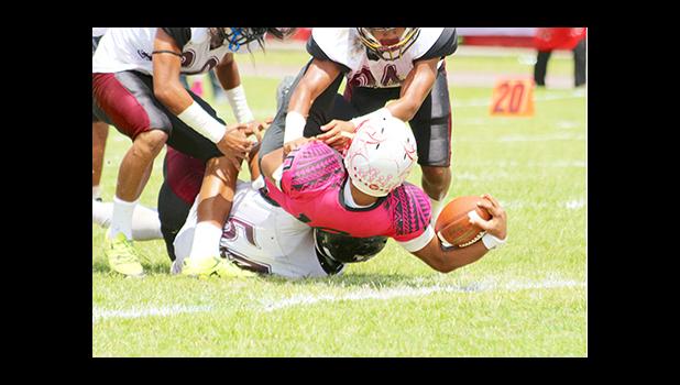Raemos Fano’s leaping touchdown in the second half of their championship game against the Warriors last Saturday – after leading the Vike’s inside the Warriors red zone, Fano muscled his way to scoring this one — as he was brought down by Warriors So’oso’o Letuli, Fano was still able to leap the football pass the goal line for his first touchdown of the game.  [photo: TG]