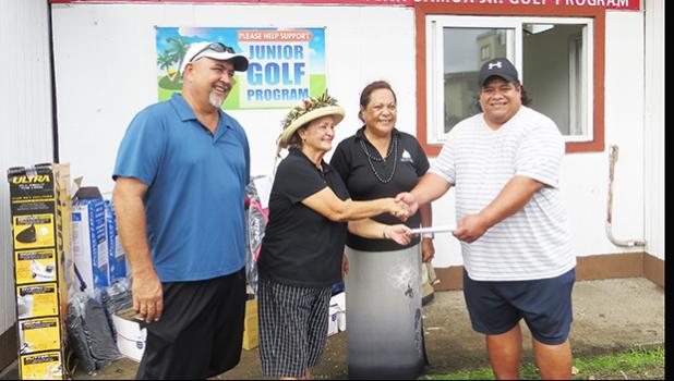 President of the Tina Drabble Junior Golfer’s Foundation, Taalolo Chande Lutu-Drabbl, handed over the check of $3,000 and assorted golf equipment to assist with the 5 junior golfers and their coaches to attend the Galaway World Junior Golfer’s Program in San Diego, California this summer. John Mitchell and Peter Young received it on behalf of the Junior Golfers Association.  [photo: Leua Aiono Frost]