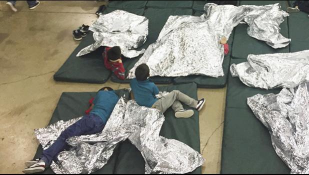   A photo provided by U.S. Customs and Border Protection shows the interior of a CBP facility in McAllen, Texas, on Sunday. Immigration officials have separated thousands of families who crossed the border illegally. Reporters taken on a tour of the facility were not allowed by agents to interview any of the detainees or take photos, the AP reported. U.S. Customs and Border Protection's Rio Grande Valley Sector via AP 
