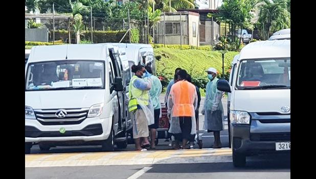 Health Dept. personnel outside area where Church Minister and his wife are quarantined. 
