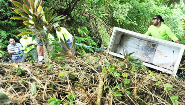 Illegal dumping is on the rise in American Samoa — especially down hillsides next to roads in outer villages. As proved in this photo, out of sight does not mean it exists no more — highly damaging toxic fluids from such dumped appliances seep into our to our drinking water, soils, oceans and coral reefs. NPAS has formed an Illegal Dumping Task Force to help clean up and stop this practice. It comprises the Office of Samoan Affairs, National Park of American Samoa and other local agencies.  [Courtesy photo]