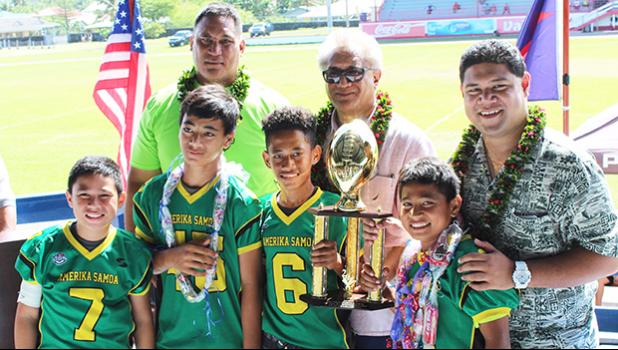 JPS Leone Lions Coach of the Year Oakland Salave’a and the Champions of the Division 2, Leone Lions. [photo:EM]